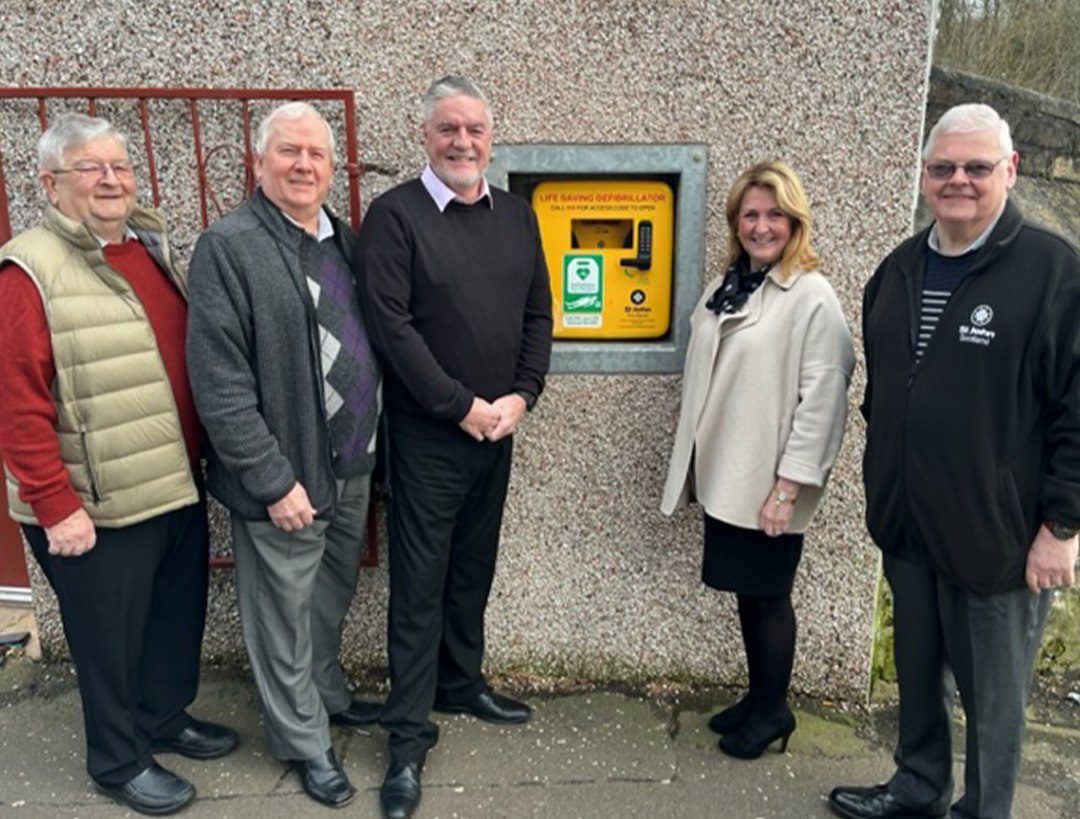Pictured at the unveiling are William Logan Treasurer, Ian Hamilton IPM, Angus MacDonald (Master of the Lodge), Jess Duncan (Chair, St John Scotland, Ayrshire and Arran), Archie Chambers (Defibrillator Lead, St John Scotland, Ayrshire and Arran) and PM.